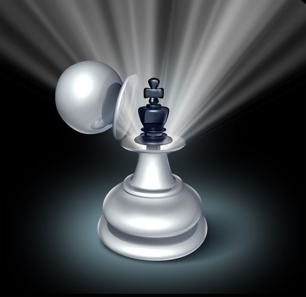 Chess pieces with a spotlight symbolise succession planning strategies and effective leadership transition.