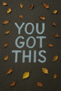 Chalk message "YOU GOT THIS" surrounded by autumn leaves, highlighting the importance of self-management.