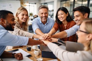 Professional team coaching session showing team members collaborating and building trust through shared work and discussion